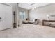 Modern living room with neutral tones, stylish furniture, and abundant natural light at 11726 Sunburst Marble Rd, Riverview, FL 33579