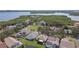 Aerial view of waterfront neighborhood with lush trees, lakes, and water access at 1175 San Carlos Ne Ave, St Petersburg, FL 33702