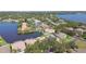 Aerial view of waterfront neighborhood shows homes with lush landscaping and waterfront access at 1175 San Carlos Ne Ave, St Petersburg, FL 33702