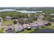 An aerial view shows backyard pool and water feature along with stunning lakes and landscaping at 1175 San Carlos Ne Ave, St Petersburg, FL 33702