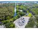 Community aerial view featuring a boat launch, tennis courts, lake, and lush landscaping at 1175 San Carlos Ne Ave, St Petersburg, FL 33702