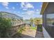 Wooden deck and serene water views create a relaxing outdoor space in this charming backyard at 1175 San Carlos Ne Ave, St Petersburg, FL 33702