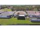 Backyard with lake views features a large yard, screen porch and screened-in pool at 1175 San Carlos Ne Ave, St Petersburg, FL 33702