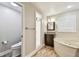 Bright bathroom with a bathtub, tiled shower, granite countertop, and a separate toilet for added privacy at 1175 San Carlos Ne Ave, St Petersburg, FL 33702