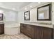 This bathroom boasts a soaking tub, a double vanity, and modern finishes, creating a spa-like experience at 1175 San Carlos Ne Ave, St Petersburg, FL 33702