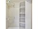 Walk-in closet featuring custom shelving and chrome closet organizers at 1175 San Carlos Ne Ave, St Petersburg, FL 33702