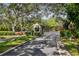 A gated entrance featuring a guardhouse with neatly landscaped surroundings at 1175 San Carlos Ne Ave, St Petersburg, FL 33702