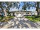 Attractive one-story home with a two-car garage and a beautiful lawn at 1175 San Carlos Ne Ave, St Petersburg, FL 33702