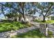 Charming home boasts mature landscaping, a stone mailbox, and an inviting driveway at 1175 San Carlos Ne Ave, St Petersburg, FL 33702
