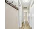 Hallway with wood-look floors, coat hooks, white trim and doors, and recessed lighting at 1175 San Carlos Ne Ave, St Petersburg, FL 33702