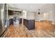 Kitchen with island, stainless appliances, granite counters, and dark wood cabinets offer a modern aesthetic at 1175 San Carlos Ne Ave, St Petersburg, FL 33702