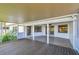 The spacious screened lanai with wood and tile flooring leads to the sunny backyard at 1175 San Carlos Ne Ave, St Petersburg, FL 33702