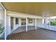 The spacious screened lanai with wood and tile flooring provides access to the outdoor patio at 1175 San Carlos Ne Ave, St Petersburg, FL 33702
