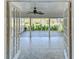 Screened lanai with tile flooring, white trim, and views of the water at 1175 San Carlos Ne Ave, St Petersburg, FL 33702