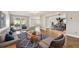 Comfortable living room showcases an open layout with a kitchen, dining area, and access to the outdoor patio at 1175 San Carlos Ne Ave, St Petersburg, FL 33702