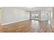 Expansive living area boasts wood-look flooring, lots of natural light, and access to the backyard at 1175 San Carlos Ne Ave, St Petersburg, FL 33702