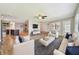 Stylishly furnished living room shows an open floor plan with views of kitchen, dining area, and outdoor patio at 1175 San Carlos Ne Ave, St Petersburg, FL 33702