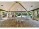 Open-air pavilion featuring dining tables and chairs with views of the community pool at 1175 San Carlos Ne Ave, St Petersburg, FL 33702