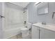 Clean bathroom with a shower-tub combo, a toilet and a vanity with a sink and a mirror at 11809 129Th Ave, Largo, FL 33778
