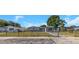 Charming single-story home with fenced front yard and a mix of stone and siding accents at 11809 129Th Ave, Largo, FL 33778