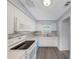 Contemporary kitchen featuring white cabinets, sleek countertops, and modern appliances at 11809 129Th Ave, Largo, FL 33778