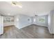 Open-concept living space with neutral paint, modern flooring, and an abundance of natural light at 11809 129Th Ave, Largo, FL 33778