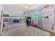 Bright bedroom with bunk bed, work station, playful decor and colorful rug at 11927 Steppingstone Blvd, Tampa, FL 33635