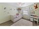 Bright bedroom with hardwood floors and ceiling fan at 11927 Steppingstone Blvd, Tampa, FL 33635