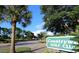 Community sign for the Countryway Golf Club in a landscaped setting with palm trees and green foliage at 11927 Steppingstone Blvd, Tampa, FL 33635