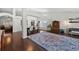 Open-concept dining room with hardwood floors, white chairs, and plenty of space at 11927 Steppingstone Blvd, Tampa, FL 33635