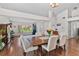Spacious dining room with hardwood floors, an open layout, and white walls at 11927 Steppingstone Blvd, Tampa, FL 33635