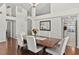 Dining room boasts wood floors, white walls, and an archway into another room at 11927 Steppingstone Blvd, Tampa, FL 33635