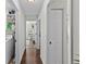 Bright hallway leading to bedrooms and laundry area at 11927 Steppingstone Blvd, Tampa, FL 33635