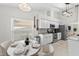 Cozy kitchen with stainless steel appliances, a breakfast nook, and tile flooring at 11927 Steppingstone Blvd, Tampa, FL 33635