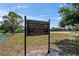 Sign for Countryway Private Park with details on hours, rules, and contact information surrounded by greenery at 11927 Steppingstone Blvd, Tampa, FL 33635