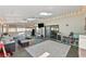 Relaxing sun room featuring tile flooring, ceiling fans, and comfortable seating at 11927 Steppingstone Blvd, Tampa, FL 33635