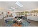 Spacious sunroom with skylights, ceiling fans, and lots of natural light at 11927 Steppingstone Blvd, Tampa, FL 33635