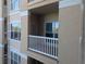 Private balcony provides an inviting outdoor space with neutral tones and white railings at 1216 S Missouri Ave # 223, Clearwater, FL 33756
