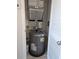 View of utility closet featuring water heater, HVAC components, and storage options at 1216 S Missouri Ave # 223, Clearwater, FL 33756