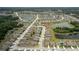 Wide angle aerial shot showcases community layout with winding roads, ponds, and green spaces at 12170 Gothic Rd, Spring Hill, FL 34610