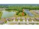 Aerial view of homes backing onto a large pond surrounded by mature trees at 12170 Gothic Rd, Spring Hill, FL 34610