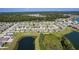 A picturesque aerial view of a well-planned community with lush green spaces and serene ponds at 12170 Gothic Rd, Spring Hill, FL 34610