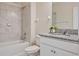 Well maintained bathroom featuring a shower-tub combo and granite countertop vanity at 12170 Gothic Rd, Spring Hill, FL 34610