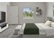 Cozy bedroom featuring a bright window, TV, and neutral decor at 12170 Gothic Rd, Spring Hill, FL 34610