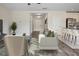 Open-concept living room with modern furniture and stylish decor flowing into a bright kitchen at 12170 Gothic Rd, Spring Hill, FL 34610