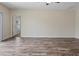 Spacious living room with wood-look flooring and natural light at 12170 Gothic Rd, Spring Hill, FL 34610