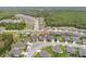 An aerial view of a well-planned community, featuring lush greenery, serene ponds, and beautifully arranged homes at 12653 Palapa Loop, Spring Hill, FL 34610