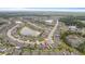 An aerial view of a community featuring a pool and other wonderful amenities at 12653 Palapa Loop, Spring Hill, FL 34610