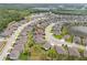 An aerial view of a well-planned community with ponds, greenery, and sidewalks at 12653 Palapa Loop, Spring Hill, FL 34610