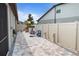 A paver stone backyard featuring a playset, a fence, and a charming area for outdoor fun at 12653 Palapa Loop, Spring Hill, FL 34610